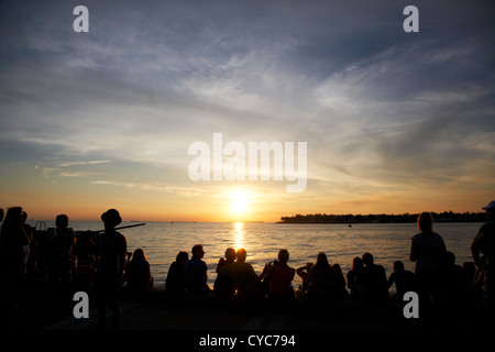 people waiting on waterfront for evening sunset celebrations mallory square key west florida usa Stock Photo