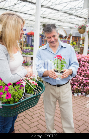 Couple deciding on a plant Stock Photo