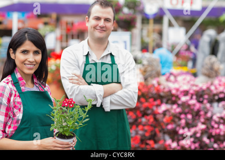 Two smiling garden center employees Stock Photo