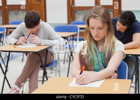 Female student sitting at table Stock Photo