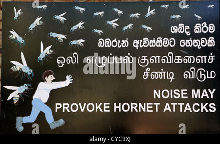 Sign at Sigiriya ancient rock temple warning of hornet attack if noise levels are too high. Stock Photo