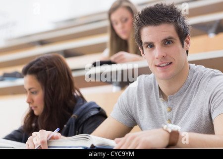 Student looking up from lecture and smiling Stock Photo