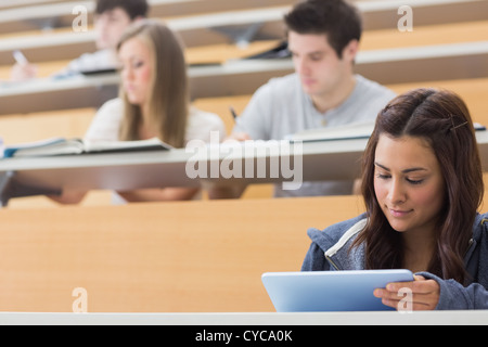 Student using tablet pc to take notes Stock Photo