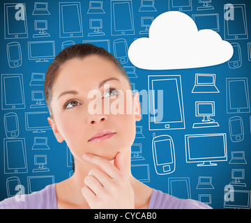 Woman thinking about cloud computing Stock Photo