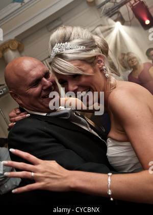 The bride and her father enjoy a dance on her wedding day Stock Photo