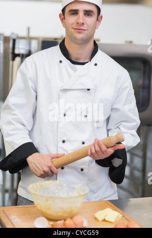 Baker holding a rolling pin Stock Photo