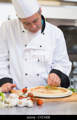 Happy chef making pizza Stock Photo