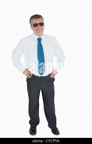 Smiling man with hands on hips Stock Photo