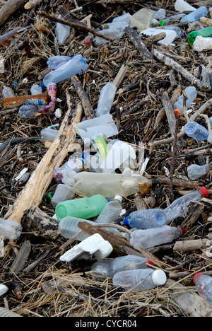 Plastic bottles, driftwood and other debris washed ashore at high tide on Saunton Beach, North Devon, England. Stock Photo