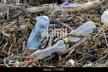 Plastic bottles, driftwood and other debris washed ashore at high tide on Saunton Beach, North Devon, England. Stock Photo