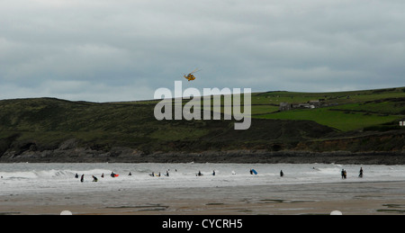 An RAF Sea King search and rescue helicopter patrols the beach at Croyde, North Devon in the Autumn. Based at Chivenor, Devon. Stock Photo