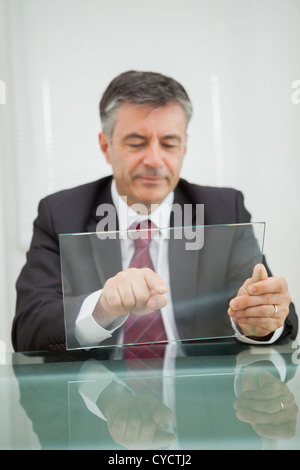 Man writing on a virtual screen Stock Photo