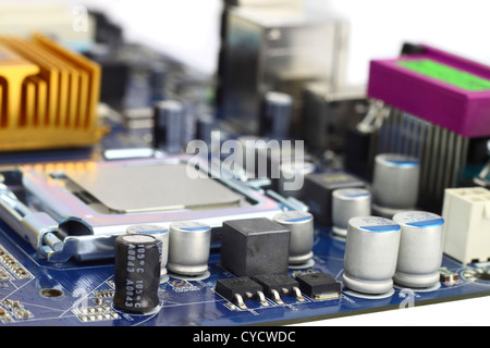 Digital hardware closeup. Microchips and condensers assembly on the circuit board macro Stock Photo