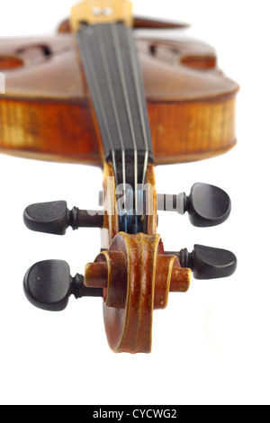 Violin macro closeup. View on scroll and pegs with neck and fingerboard in background Stock Photo