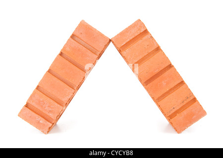 Two clay bricks leaning against each other Stock Photo