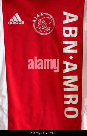 ABN Amro adidas Ajax Amsterdam logos on red football shirt Stock Photo