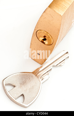 Padlock with key next to it on a white background Stock Photo - Alamy