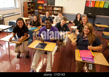 Happy students in a Catholic high school classroom are glad to be studying English. Stock Photo