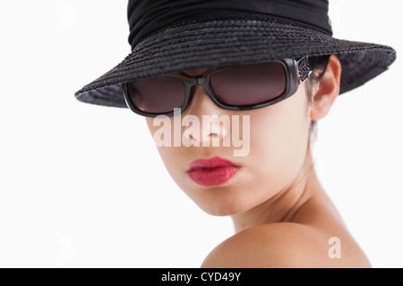 Woman wearing sun glasses and hat Stock Photo