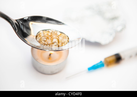 Heroin being cooked Stock Photo