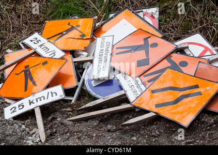 Roadworks signs piled up on the side of a road in West Cork, Ireland Stock Photo