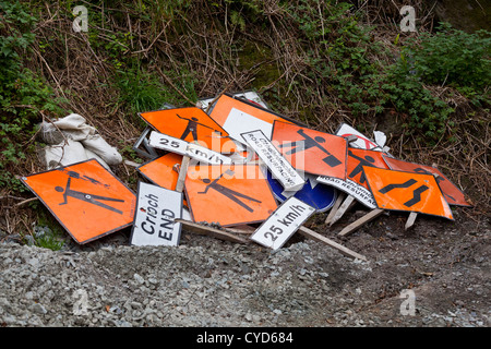 Roadworks signs piled up on the side of a road in West Cork, Ireland Stock Photo