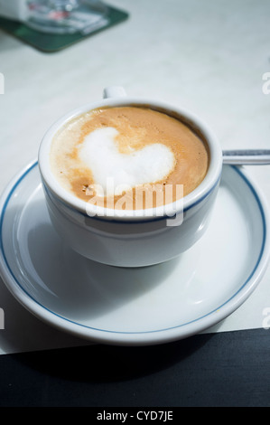 Cafe con leche with heart shape in the frothy milk on top Stock Photo