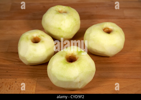 four peeled bramley cooking apples Stock Photo