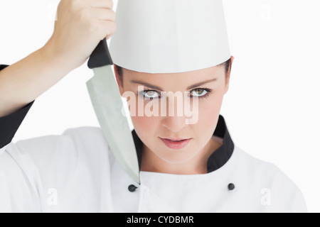 Crazy chef holding knife Stock Photo