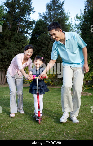 Chinese family of three, ride bike Stock Photo