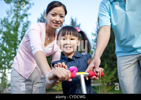 Chinese family of three, ride bike Stock Photo