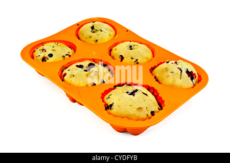 Six cupcakes with berries in orange silicone mold isolated on white background Stock Photo