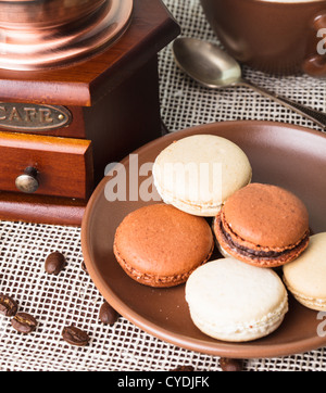 Three colors of macaroons in brown and beige tones Stock Photo