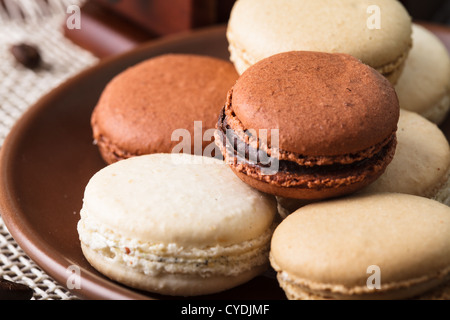 Three colors of macaroons in brown and beige tones Stock Photo