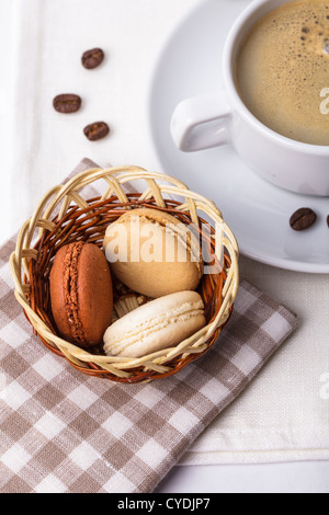 Three colors of macaroons in brown and beige tones Stock Photo