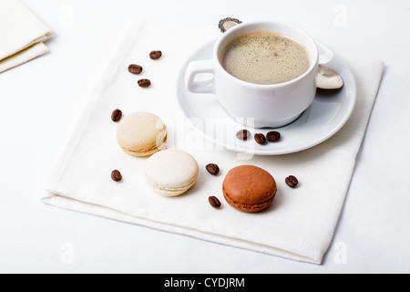 Three colors of macaroons in brown and beige tones Stock Photo