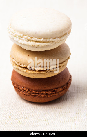 Three colors of macaroons in brown and beige tones Stock Photo