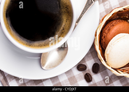 Three colors of macaroons in brown and beige tones Stock Photo