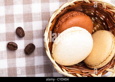 Three colors of macaroons in brown and beige tones Stock Photo