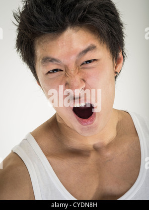 Angry frustrated young asian man Stock Photo