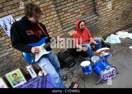 Buskers playing on a street, Brick Lane, London Stock Photo