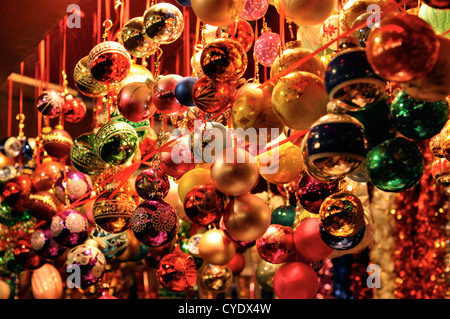 Brightly-coloured baubles at a Cologne Christmas market Stock Photo