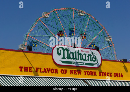 Wonder wheel in Astroland amusement park on Coney Island,with Nathans famous hot dog restaurant New York,New York,United States Stock Photo