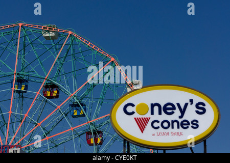 Wonder wheel in Astroland amusement park on Coney Island, with boardwalk ice cream shop sign, New York, New York, United States Stock Photo