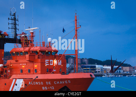 Spain, Asturias Region, Asturias Province, Aviles, fireboat, dusk Stock Photo