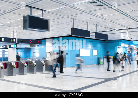 Walking people in a subway station. Motion blurred. Stock Photo