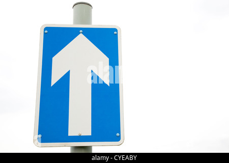 Blue One Way Sign against White Background Stock Photo