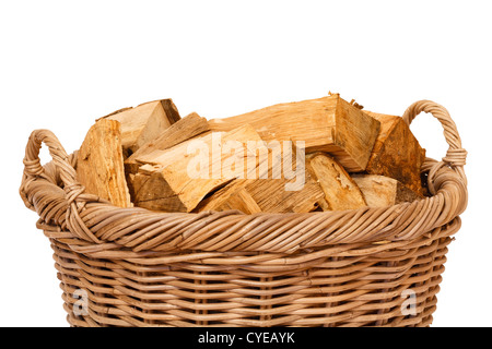 Closeup of a wicker log basket with oak logs isolated against a white background Stock Photo