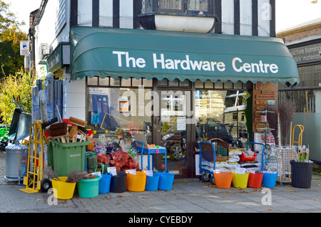 Hardware business corner shop front premises green canopy over store window & household merchandise products displayed on pavement Sevenoaks Kent UK Stock Photo