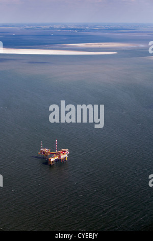 The Netherlands, Schiermonnikoog Island, belonging to Wadden Sea Islands. Aerial. NAM gas drilling rig near mud flats. Stock Photo
